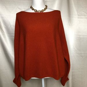 Rust orange knit sweater.